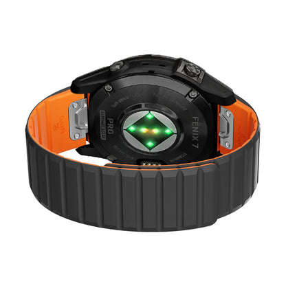 Garmin with black and orange band on a white background