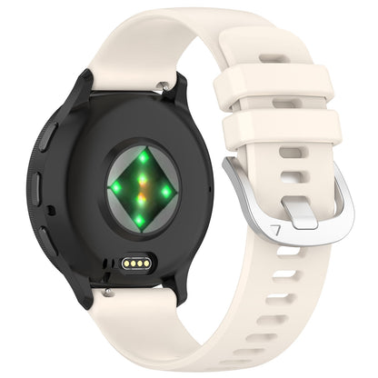 Garmin with a cream band on a white background