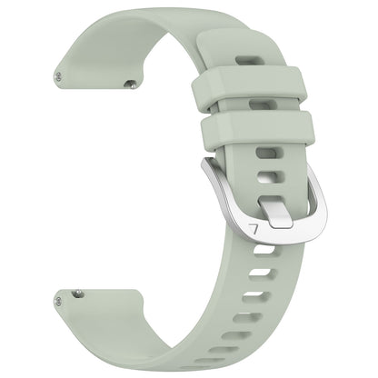 Light green watch strap on a white background