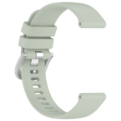 Light green watch strap on a white background