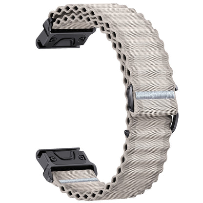 Metallic watch strap with black clasp on a white background