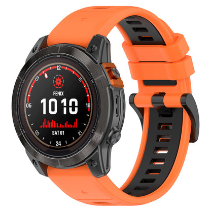 Garmin Fenix with orange and black band on a white background